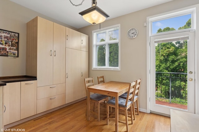 dining area featuring plenty of natural light and light wood-style floors