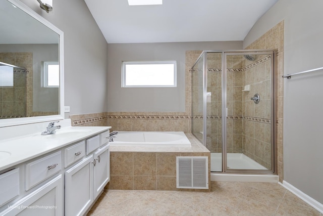 full bath with a sink, tile patterned floors, a stall shower, and visible vents