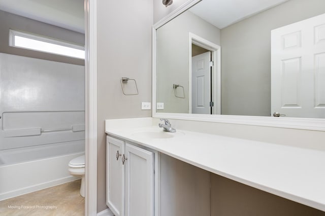 bathroom with vanity, tile patterned floors, and toilet