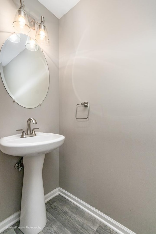 bathroom featuring baseboards and wood finished floors