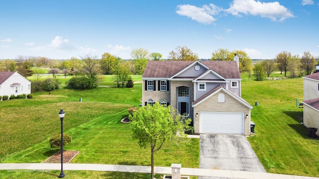 view of front of house featuring brick siding, a garage, a front yard, a chimney, and driveway
