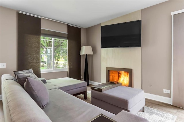436 Yorktown Ct, Aurora, IL 60504 - living room with baseboards, a lit fireplace, and wood finished floors