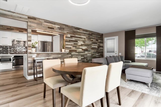436 Yorktown Ct, Aurora, IL 60504 - dining space with light wood-type flooring and visible vents