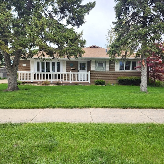 5900 W 110th St, Chicago Ridge, IL 60415 - ranch-style home with a porch, brick siding, and a front yard