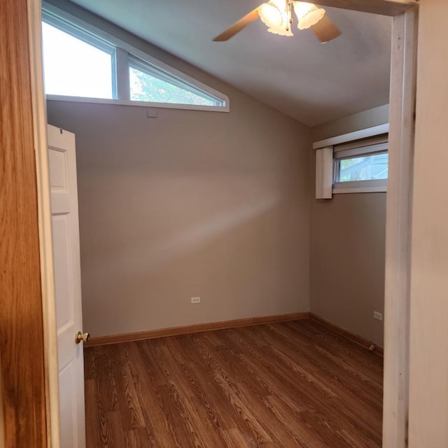 5900 W 110th St, Chicago Ridge, IL 60415 - unfurnished room with vaulted ceiling, ceiling fan, baseboards, and dark wood-style floors