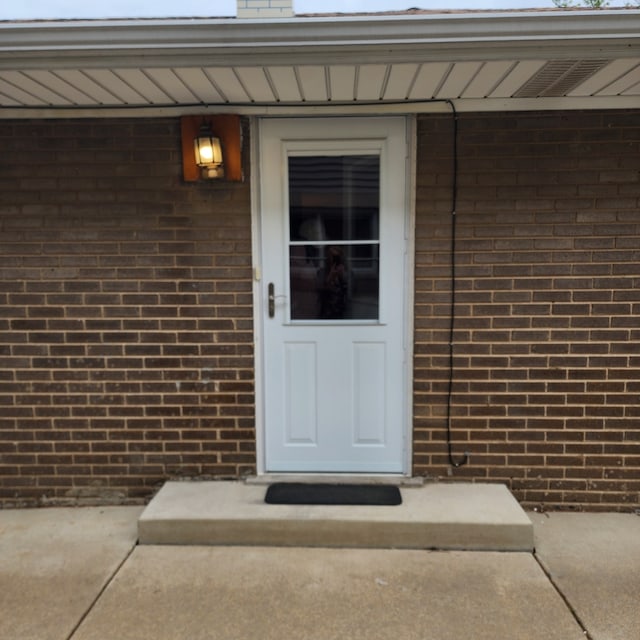 5900 W 110th St, Chicago Ridge, IL 60415 - property entrance featuring brick siding