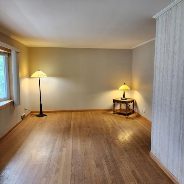 5900 W 110th St, Chicago Ridge, IL 60415 - spare room with ornamental molding, baseboards, visible vents, and wood finished floors