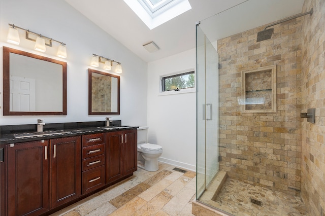 full bath with a sink, a stall shower, and toilet