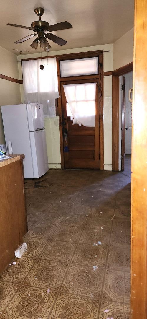 7943 S Vernon Ave, Chicago, IL 60619 - kitchen with freestanding refrigerator and a ceiling fan