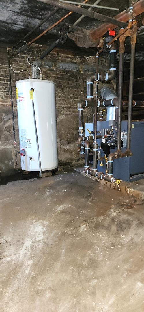 7943 S Vernon Ave, Chicago, IL 60619 - basement featuring water heater