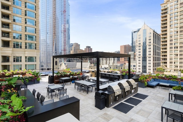view of patio / terrace with a city view, outdoor lounge area, and grilling area