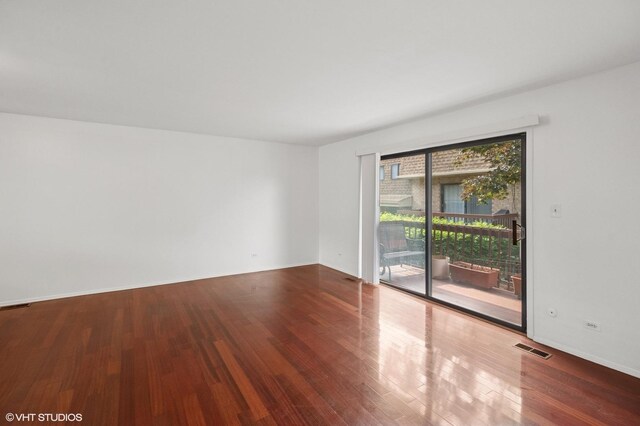 8746 Kedvale Ave Unit C, Skokie, IL 60076 - unfurnished room featuring wood finished floors and baseboards