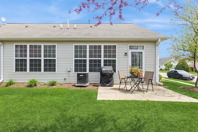 13472 Delaney Rd, Huntley, IL 60142 - back of house with a yard, a patio area, central air condition unit, and a shingled roof