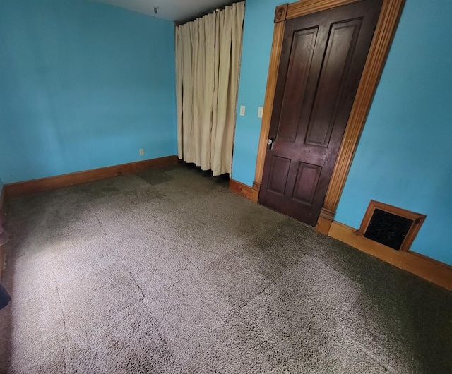 unfurnished bedroom featuring visible vents, baseboards, and carpet floors