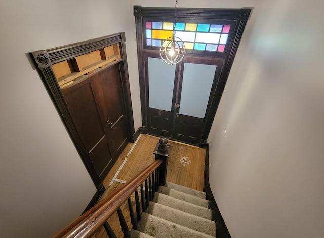 entryway featuring baseboards and stairs