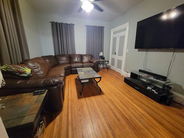 living area featuring wood finished floors and a ceiling fan