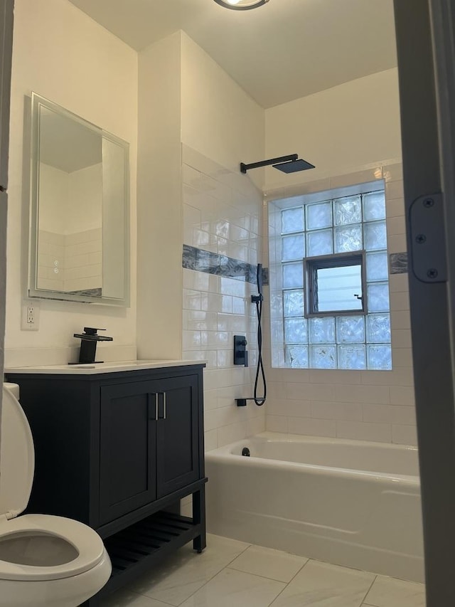 full bath with toilet, tile patterned flooring, vanity, and shower / bathtub combination