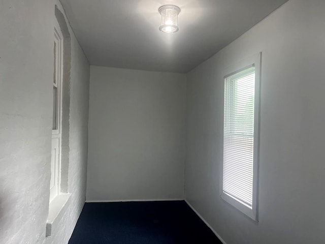 empty room featuring baseboards