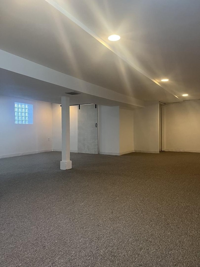 below grade area with dark carpet