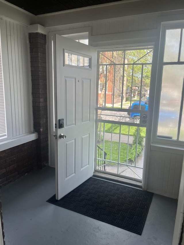 doorway with finished concrete flooring
