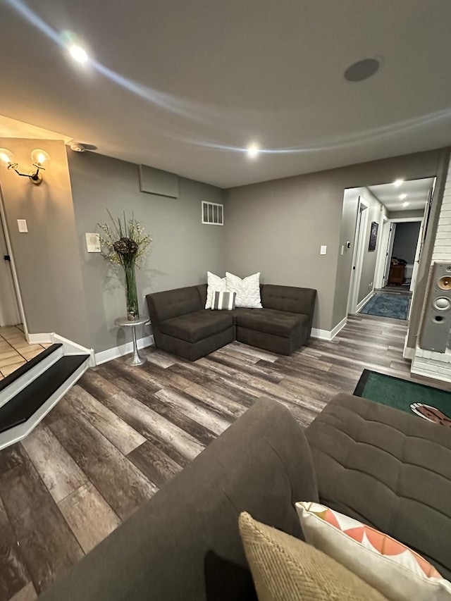 living room with wood finished floors and baseboards