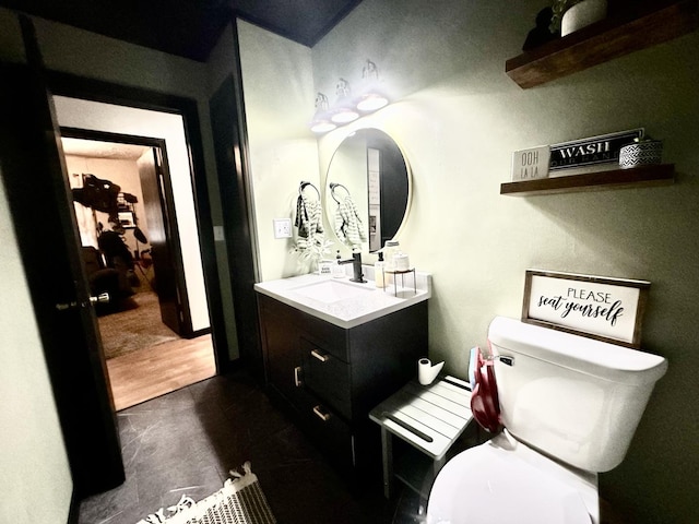 1310 E 15th Rd, Streator, IL 61364 - half bathroom featuring toilet, wood finished floors, and vanity