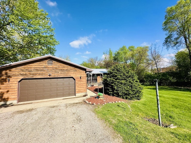 1310 E 15th Rd, Streator, IL 61364 - ranch-style home featuring metal roof, a front lawn, and a garage