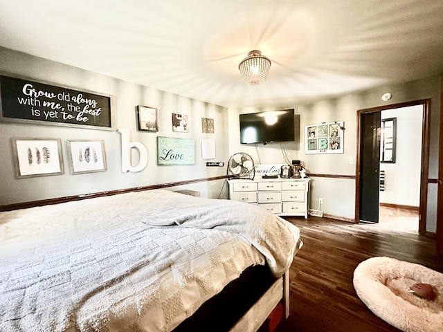 1310 E 15th Rd, Streator, IL 61364 - bedroom featuring dark wood-style flooring and baseboards
