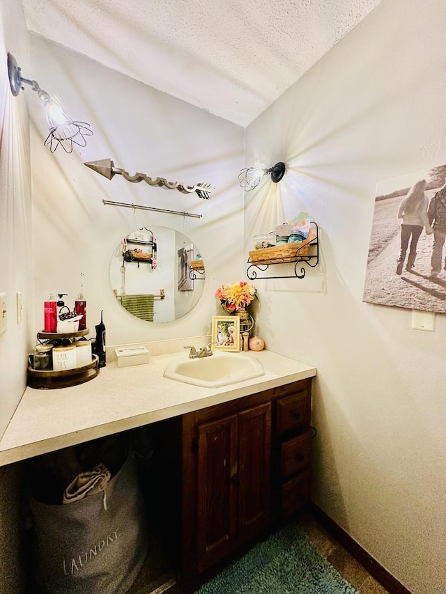 1310 E 15th Rd, Streator, IL 61364 - bathroom featuring a textured ceiling and vanity