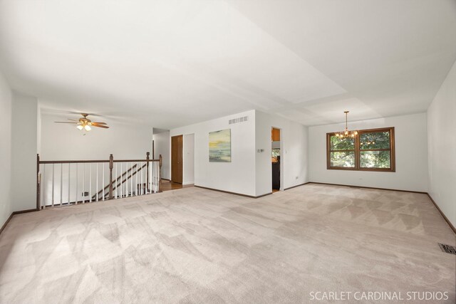 6540 Terrace Dr, Downers Grove, IL 60516 - carpeted empty room with a chandelier, baseboards, and ceiling fan