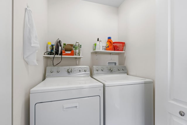 laundry room with washer and clothes dryer and laundry area