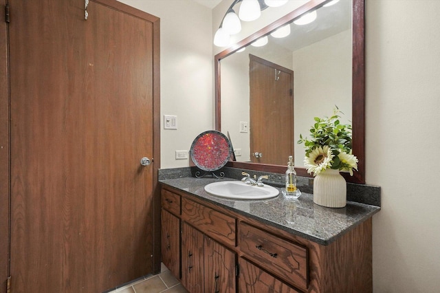 bathroom with tile patterned flooring and vanity