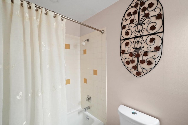 bathroom with toilet and shower / tub combo with curtain
