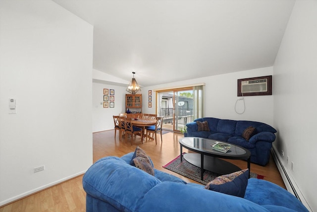 living room featuring vaulted ceiling, a baseboard radiator, a wall unit AC, baseboards, and wood finished floors