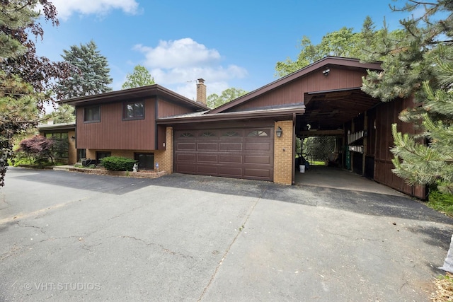 20W315 S Frontage Rd, Lemont, IL 60439 - split level home with driveway, brick siding, an attached garage, and a chimney