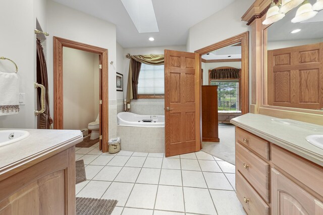 2835 N Bulrush Ct, Coal City, IL 60416 - full bath with vanity, a skylight, toilet, tile patterned floors, and a bath