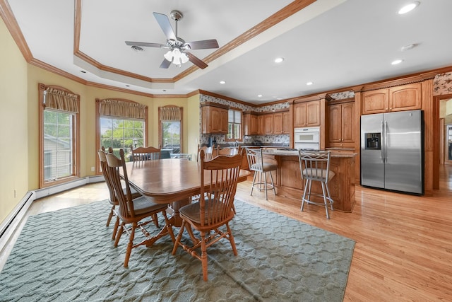 2835 N Bulrush Ct, Coal City, IL 60416 - dining room featuring crown molding, light wood-style floors, a tray ceiling, recessed lighting, and ceiling fan