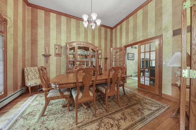 2835 N Bulrush Ct, Coal City, IL 60416 - dining space with a baseboard radiator, wood finished floors, a chandelier, crown molding, and french doors