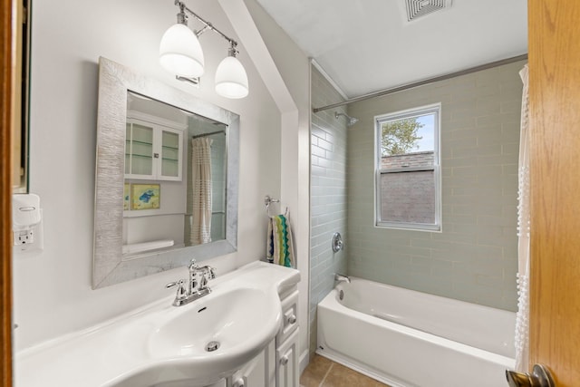 bathroom featuring shower / bath combination, vanity, and tile patterned flooring