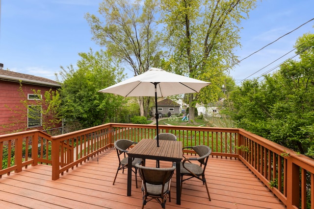 wooden terrace featuring outdoor dining area