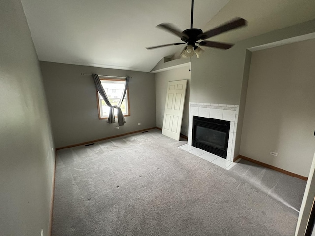 17242 W Rich Ct, Elwood, IL 60421 - unfurnished living room with lofted ceiling, baseboards, light colored carpet, a tile fireplace, and a ceiling fan