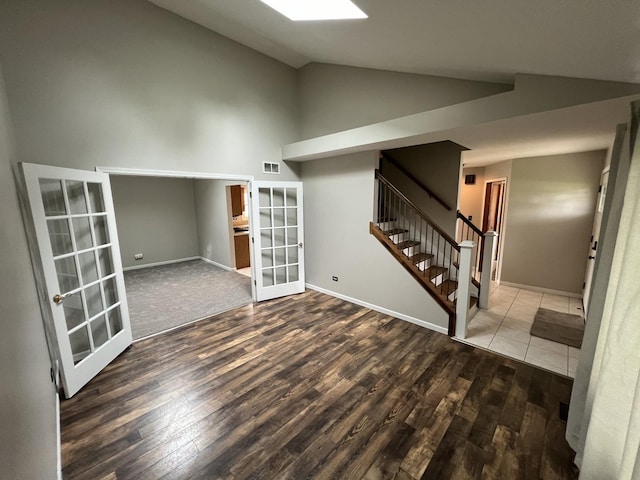 17242 W Rich Ct, Elwood, IL 60421 - interior space featuring wood finished floors, french doors, stairs, and high vaulted ceiling