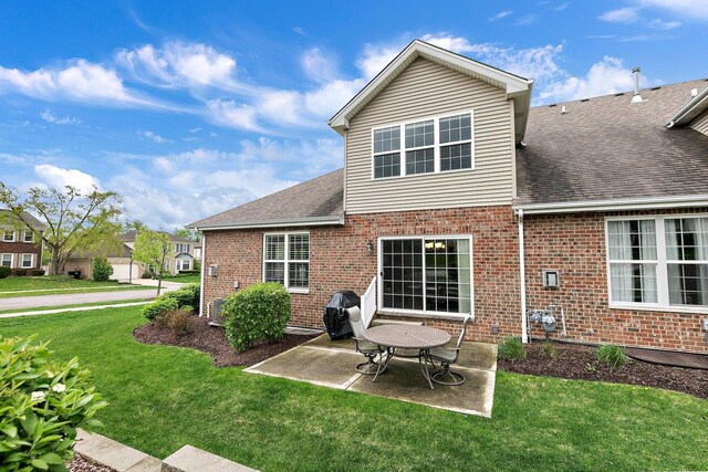 11130 Alpine Ln, Orland Park, IL 60467 - back of property featuring brick siding, a shingled roof, a patio area, and a yard