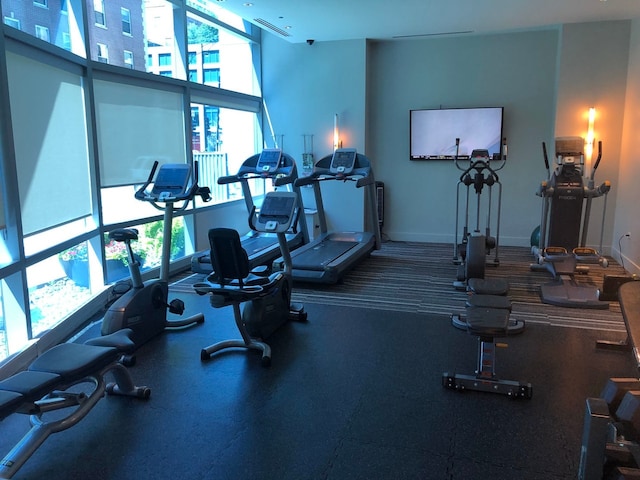 gym featuring baseboards