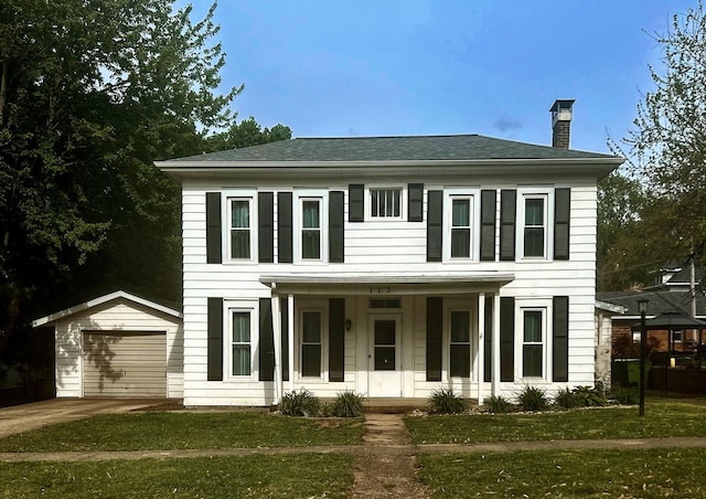 colonial inspired home with an outdoor structure, a chimney, a porch, and a front yard