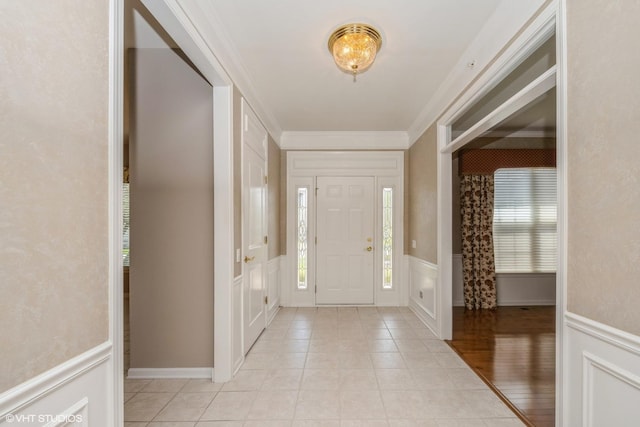 14112 Redmond Dr, Huntley, IL 60142 - entryway with light tile patterned flooring, a decorative wall, wainscoting, and ornamental molding