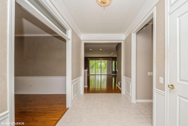 14112 Redmond Dr, Huntley, IL 60142 - hallway with light wood-style flooring and a wainscoted wall