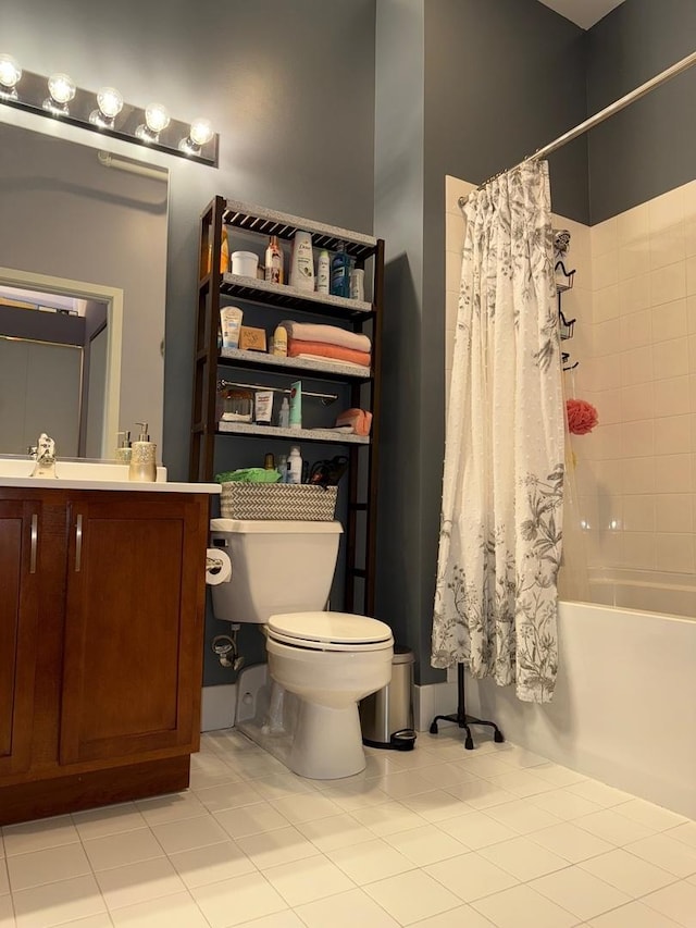full bathroom with vanity, toilet, tile patterned flooring, and shower / bath combo