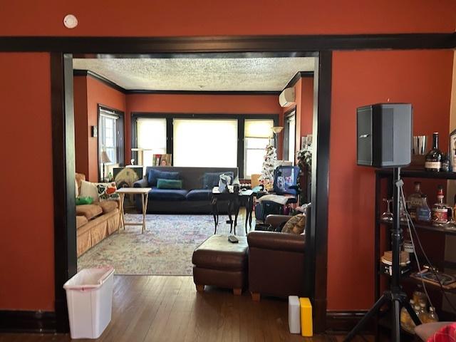 3717 W Addison St, Chicago, IL 60618 - living area featuring crown molding and wood finished floors