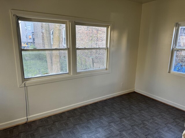 empty room featuring baseboards